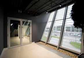 Fire-resistant glazed doors in project Encore Fitness
